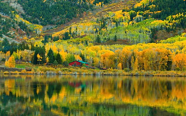 golden_autumn_reflections_at_a_rocky_mountain_farmstead_-_imgur.jpg