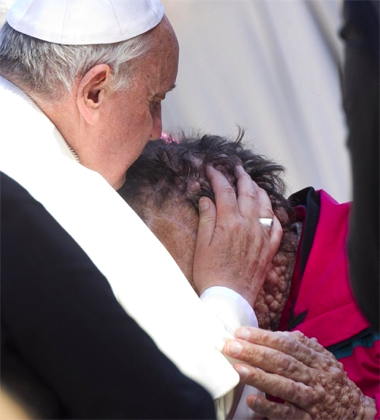 pope_francis_kisses_a_man_suffering_from_boils_in_saint_peters_square_at_the_end_of_his_wednesday_general_audience_nov_6_2013_credit_ansa_claudio_peri_cna_11_6_13.jpg